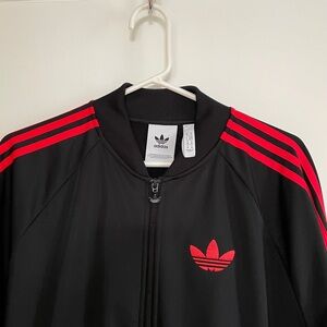 Black and red Adidas track top